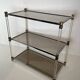 Lucite Shelf with Three Smoked Glass Shelves and Brass Ends. Work