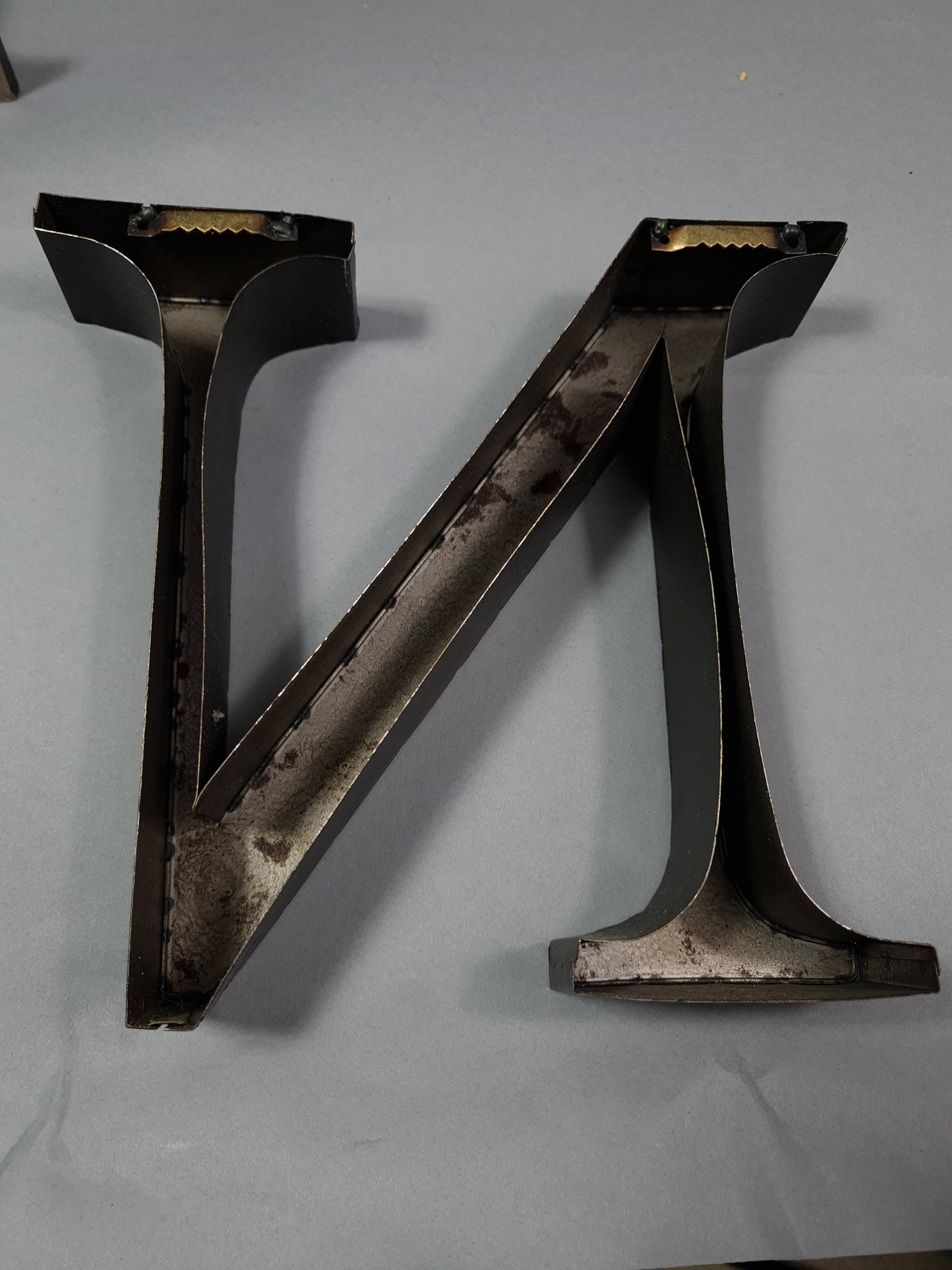 "kitchen" lettering set in blackened metal