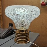 1970s table lamp in worked glass and gold metal