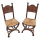 Pair of Neo-Renaissance oak chairs with straw seats, 1910
