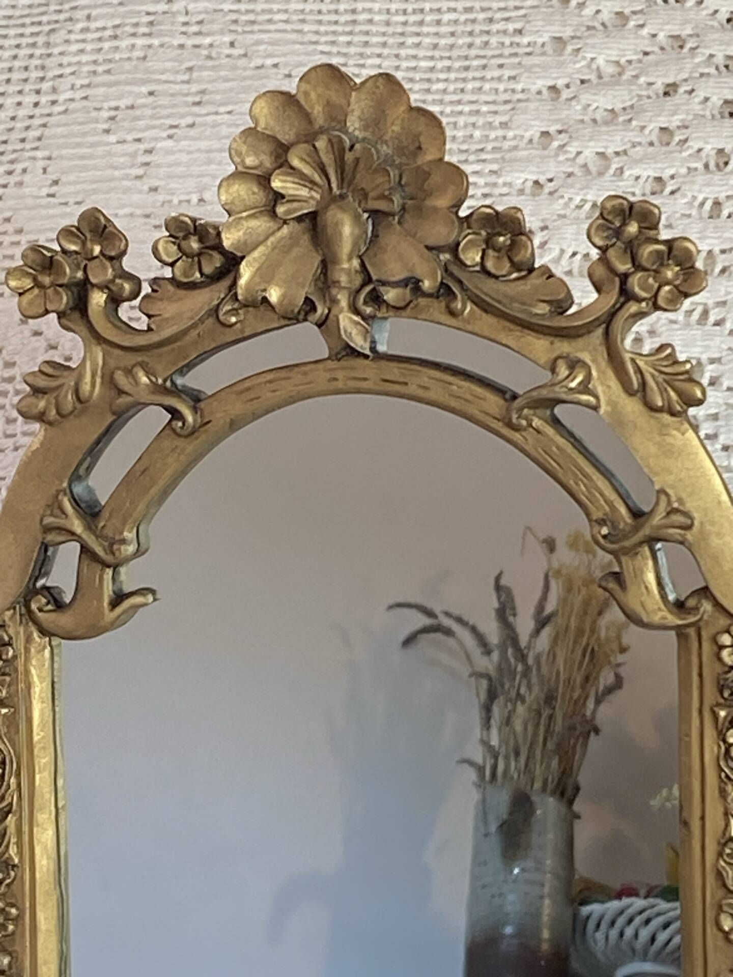 Baroque style mirror, decorated with shells and flowers.