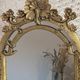 Baroque style mirror, decorated with shells and flowers.