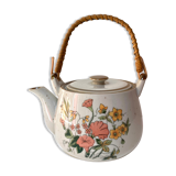 Vintage teapot in stoneware handle in rattan