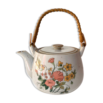 Vintage teapot in stoneware handle in rattan