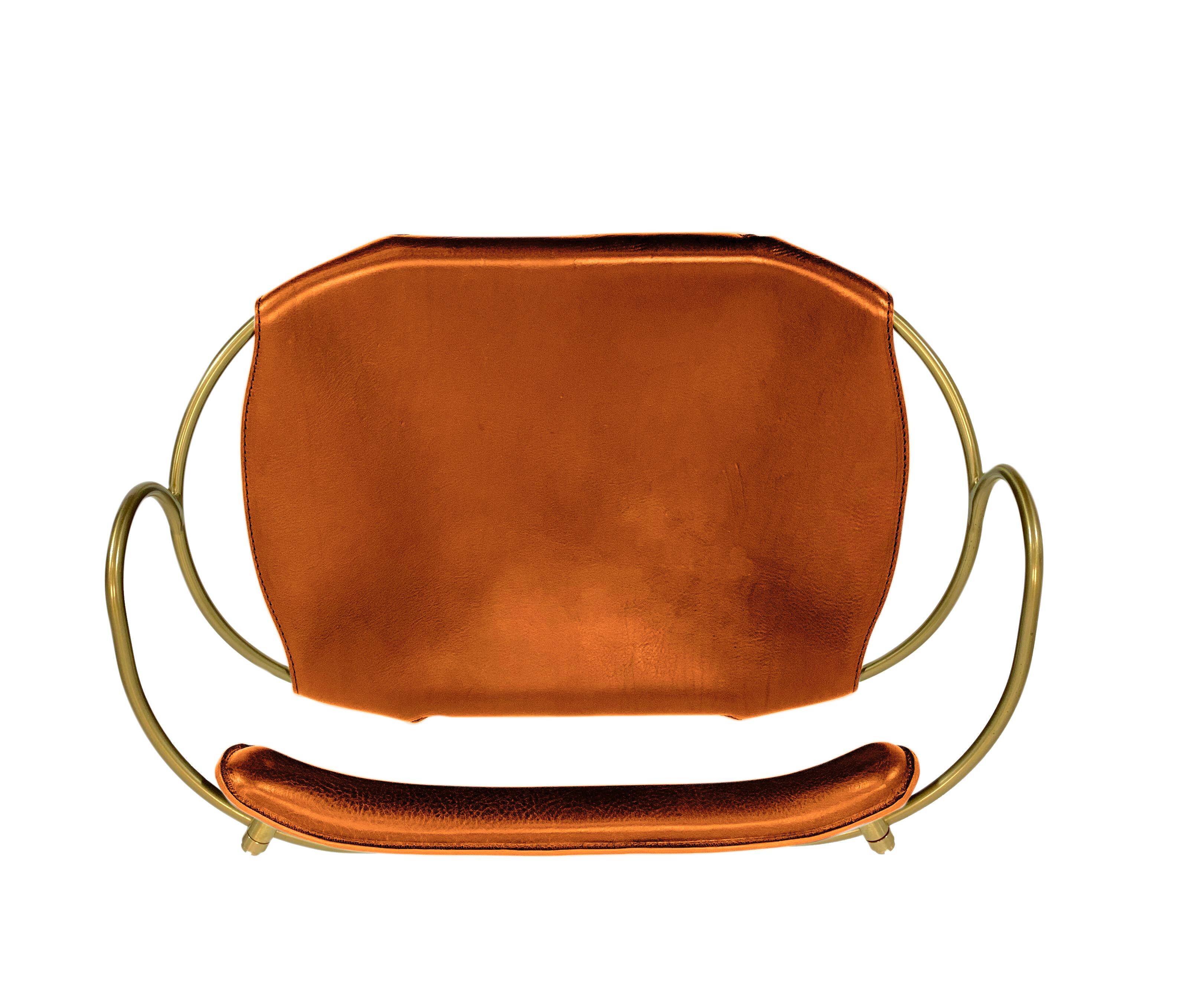 Kitchen bar stool with a brass metal backrest and natural tan tobacco leather.