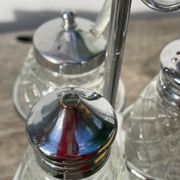 Silver-plated metal and glass salt and pepper shakers