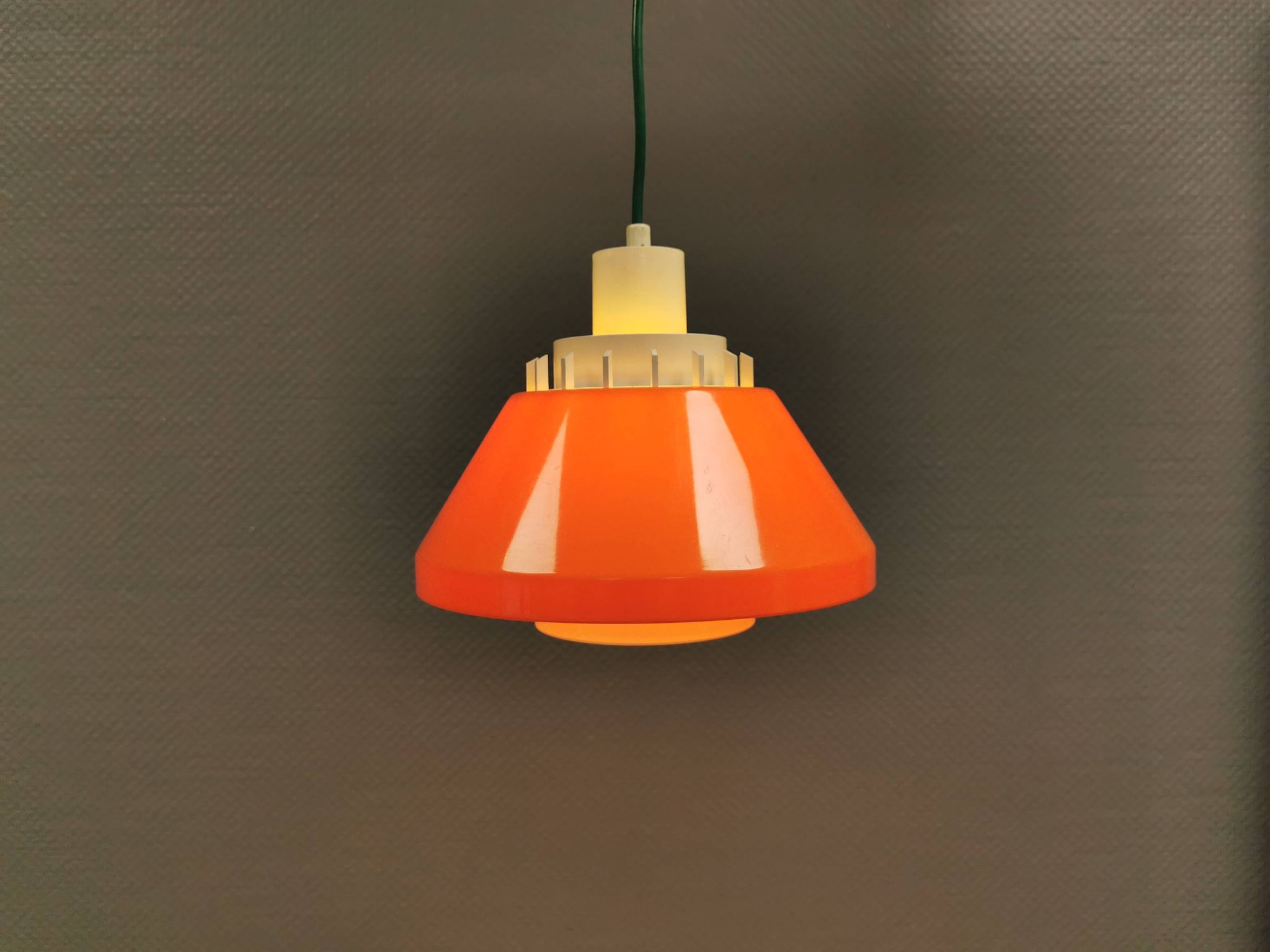 An orange pendant lamp made from hard-pressed ABS plastic. Denmark 1970s