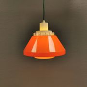 An orange pendant lamp made from hard-pressed ABS plastic. Denmark 1970s