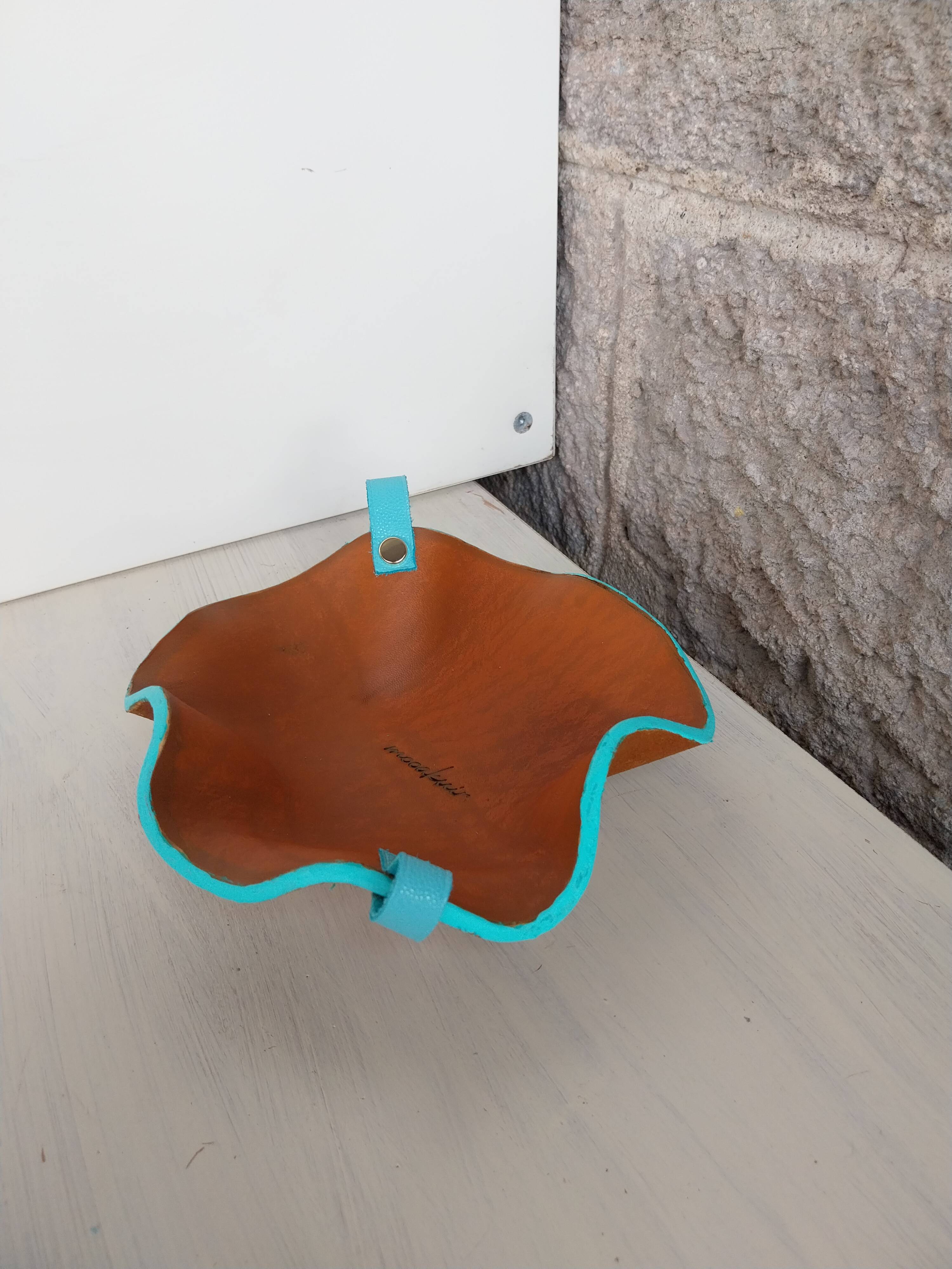 Leather shaped pocket emptier