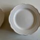 Set of 7 Mougins plates in white enamelled clay with gadroons