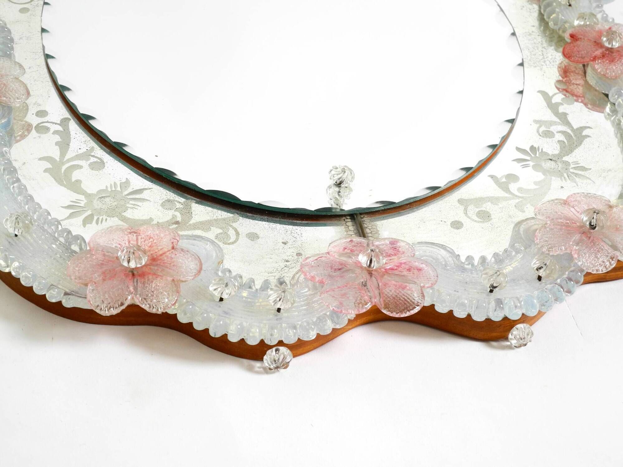 Italian mid-century wall mirror with a Murano glass frame and blossoms