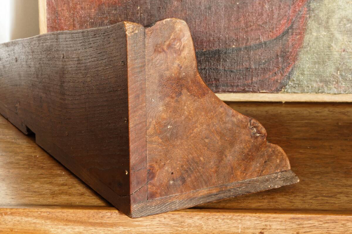 Small brutalist corner shelf in solid oak.