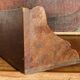 Small brutalist corner shelf in solid oak.