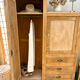 Asymmetrical wardrobe in raw wood