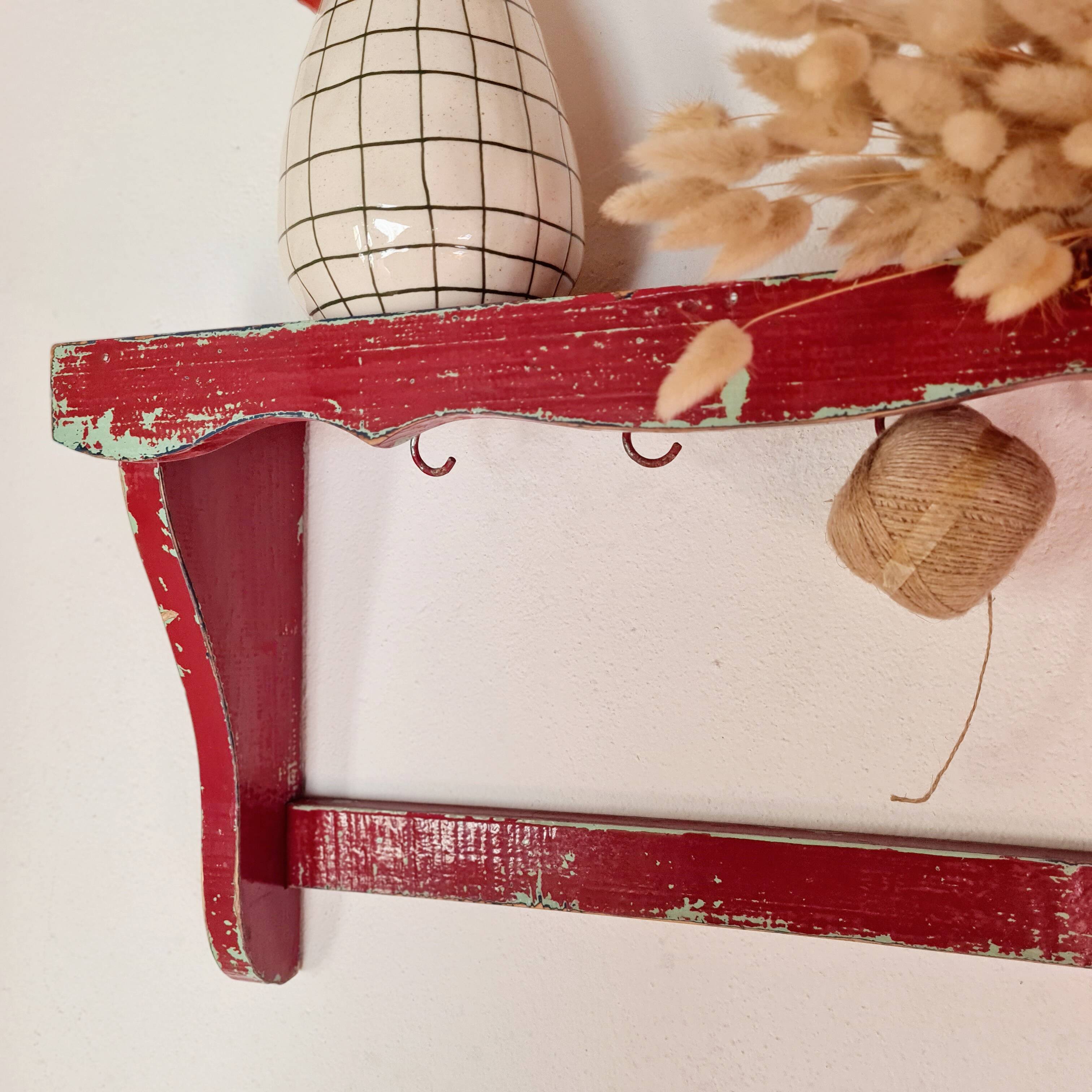Wall shelf in garnet red wood
