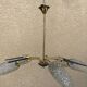 Brass and moulded glass chandelier, Bakelite arrow, 1950s, 5 lamps.