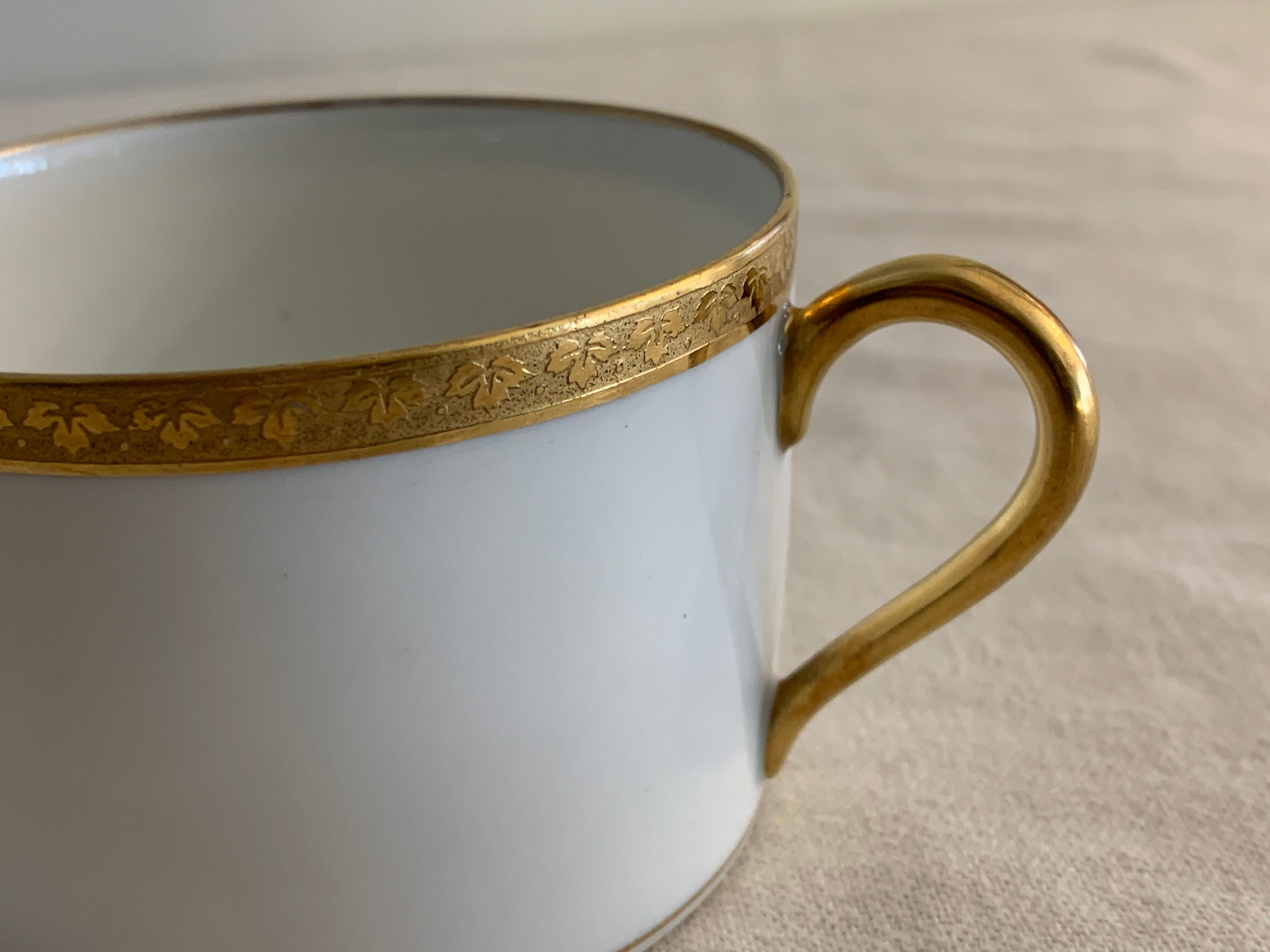 12 coffee cups and 12 white porcelain cups of Gold Gold Limoges