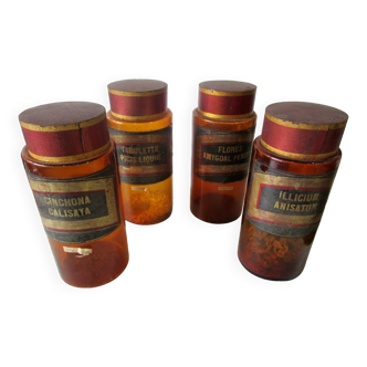 Set of 4 pharmacy jars, in amber glass.