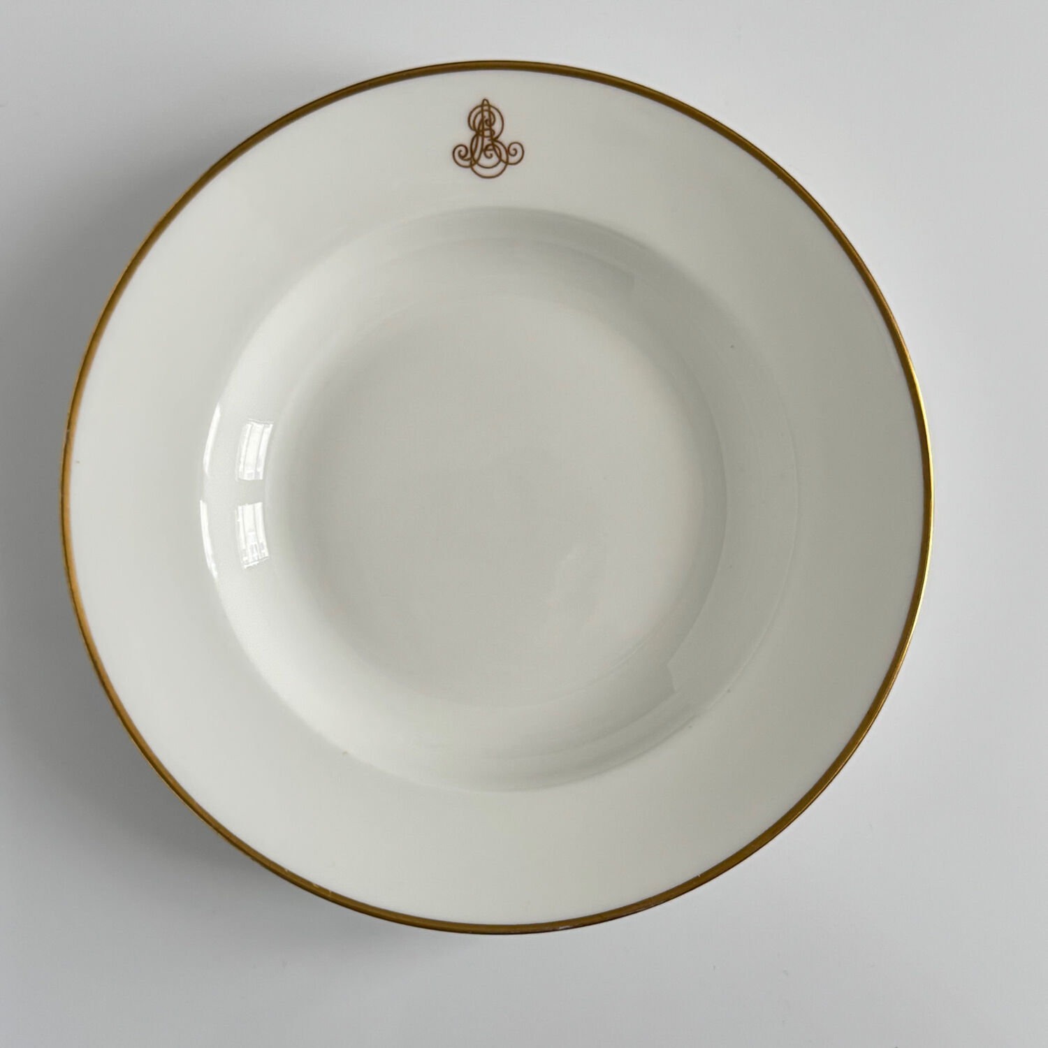 Set of monogrammed plates with gilt edges | E. Bourgeois | Late 19th century