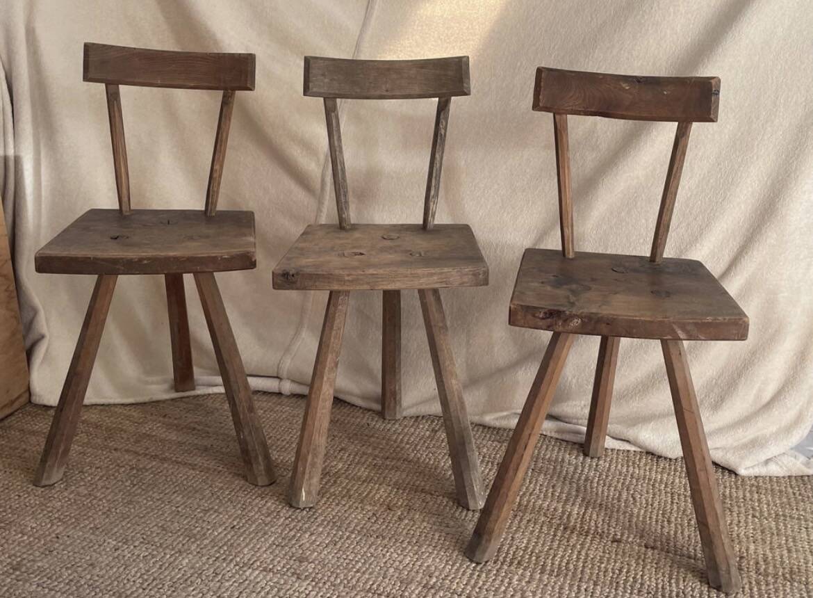 Set of three wooden tripod chairs in oak, raw art.