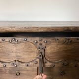 Very old elm wood with carved patterns and ironwork pieces.