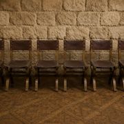 Set of six Renaissance-style chairs in oak and leather.