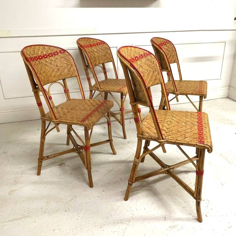 Set of 4 antique chairs in woven red and natural rattan.