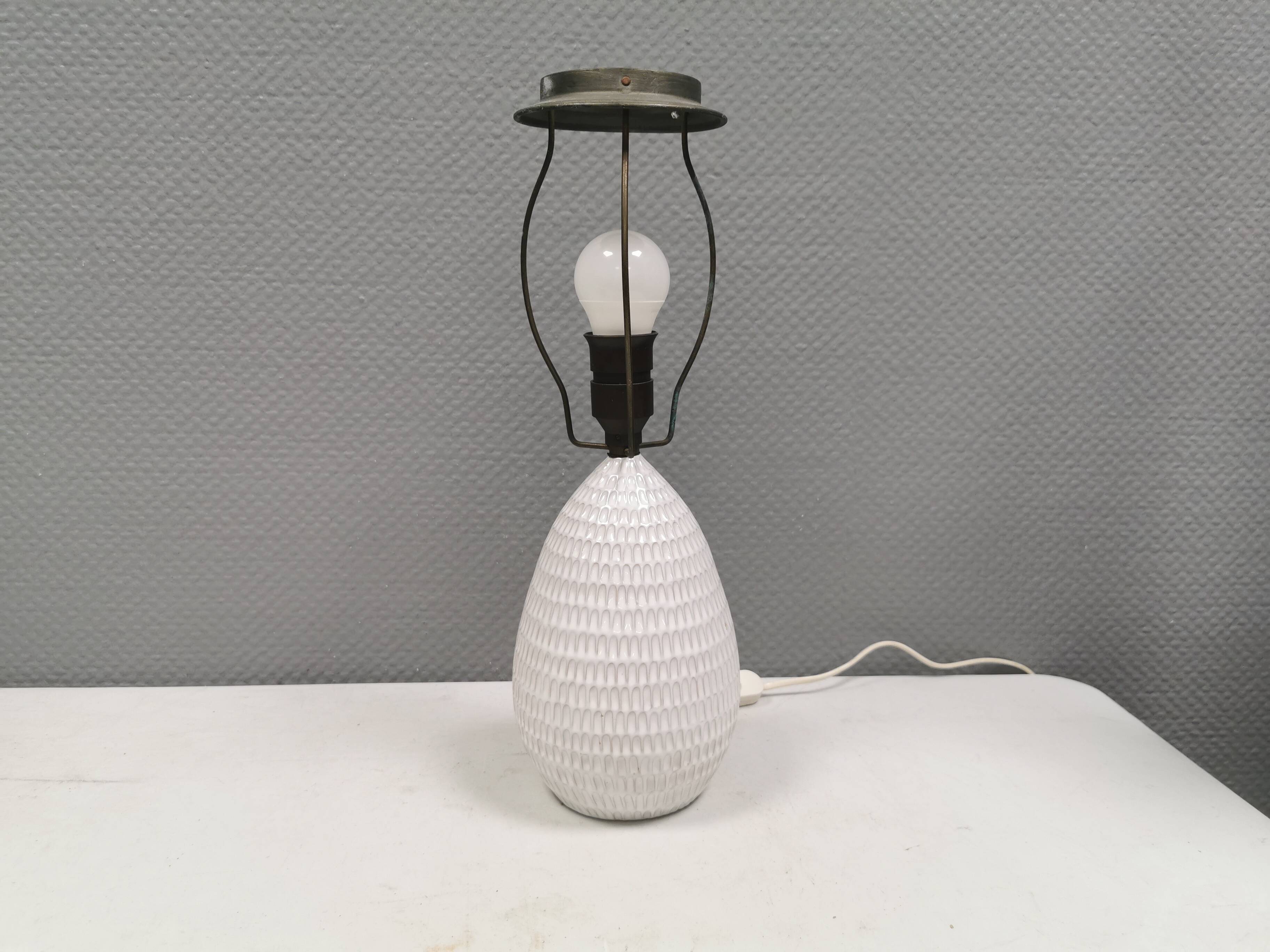 Older ceramic table lamp with beautiful details.