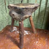 Old brutalist design wooden tripod stool