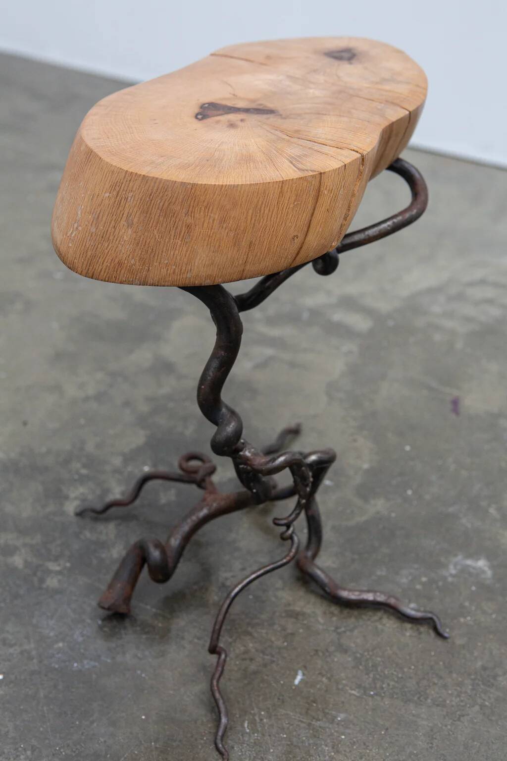 Brutalist artisanal wrought iron and slab wood side table