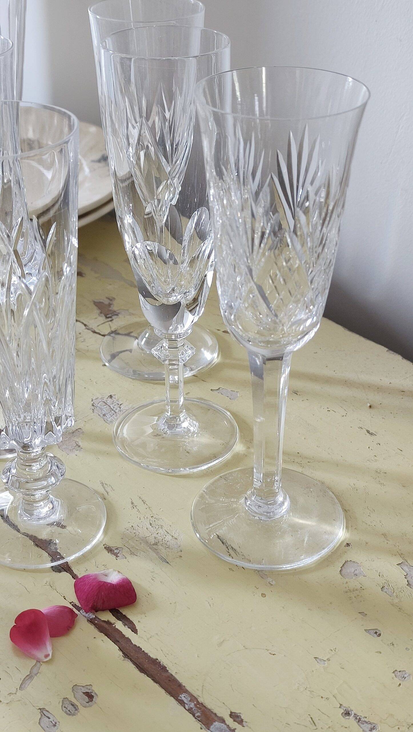 Mismatched set of prestigious crystal champagne flutes
