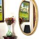 Large oval Florentine mirror in carved wood and gilded with gold leaf.