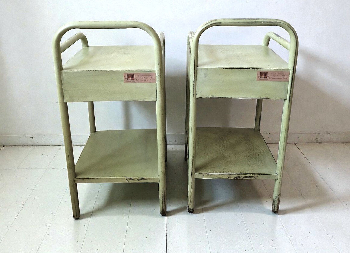 Copy of a pair of patinated metal bedside tables.