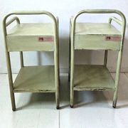 Copy of a pair of patinated metal bedside tables.