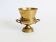Vintage brass cache-pot on a stand with handles, classic decor.