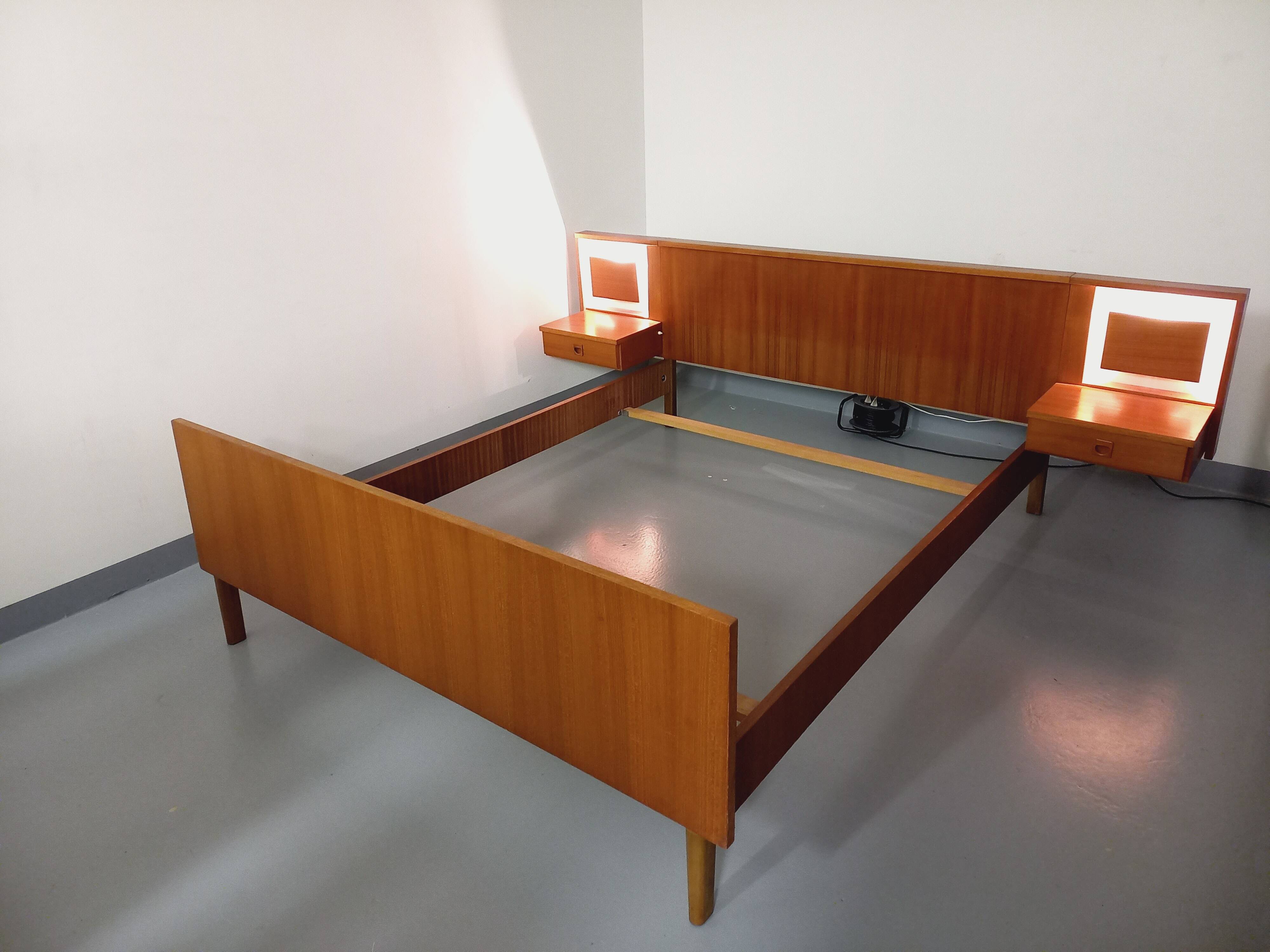 Vintage Scandinavian style double bed in teak from the 60s with integrated bedside lights