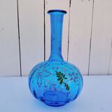 Vintage twisted blue glass carafe with enamel decoration.