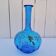 Vintage twisted blue glass carafe with enamel decoration.
