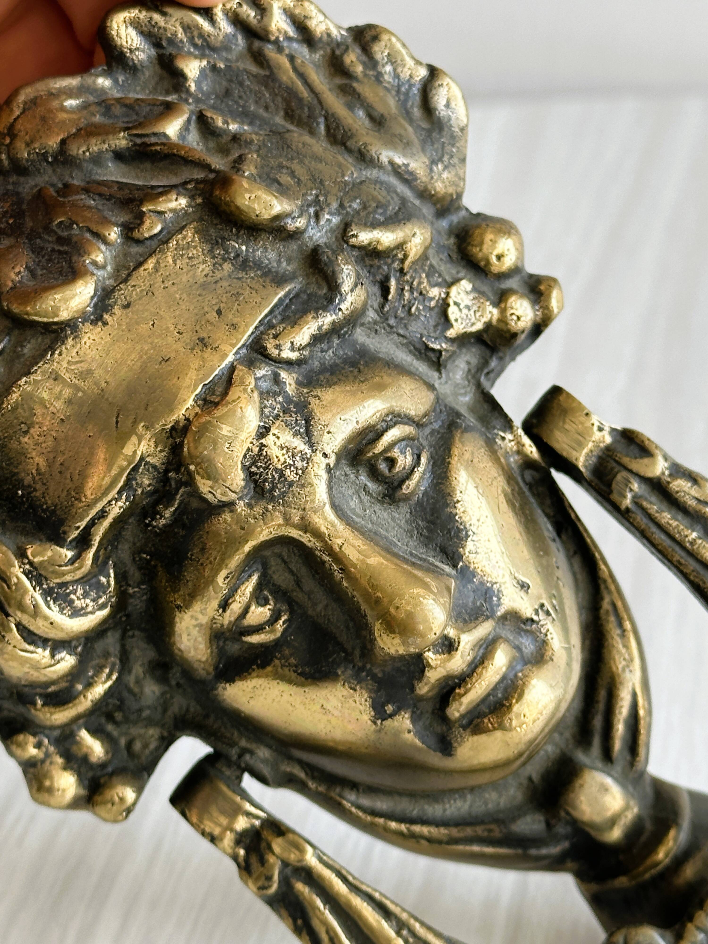 Large antique style brass metal knocker.