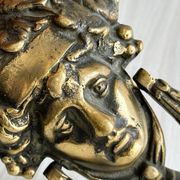 Large antique style brass metal knocker.
