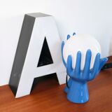 Ceramic lamp hands holding blue globe