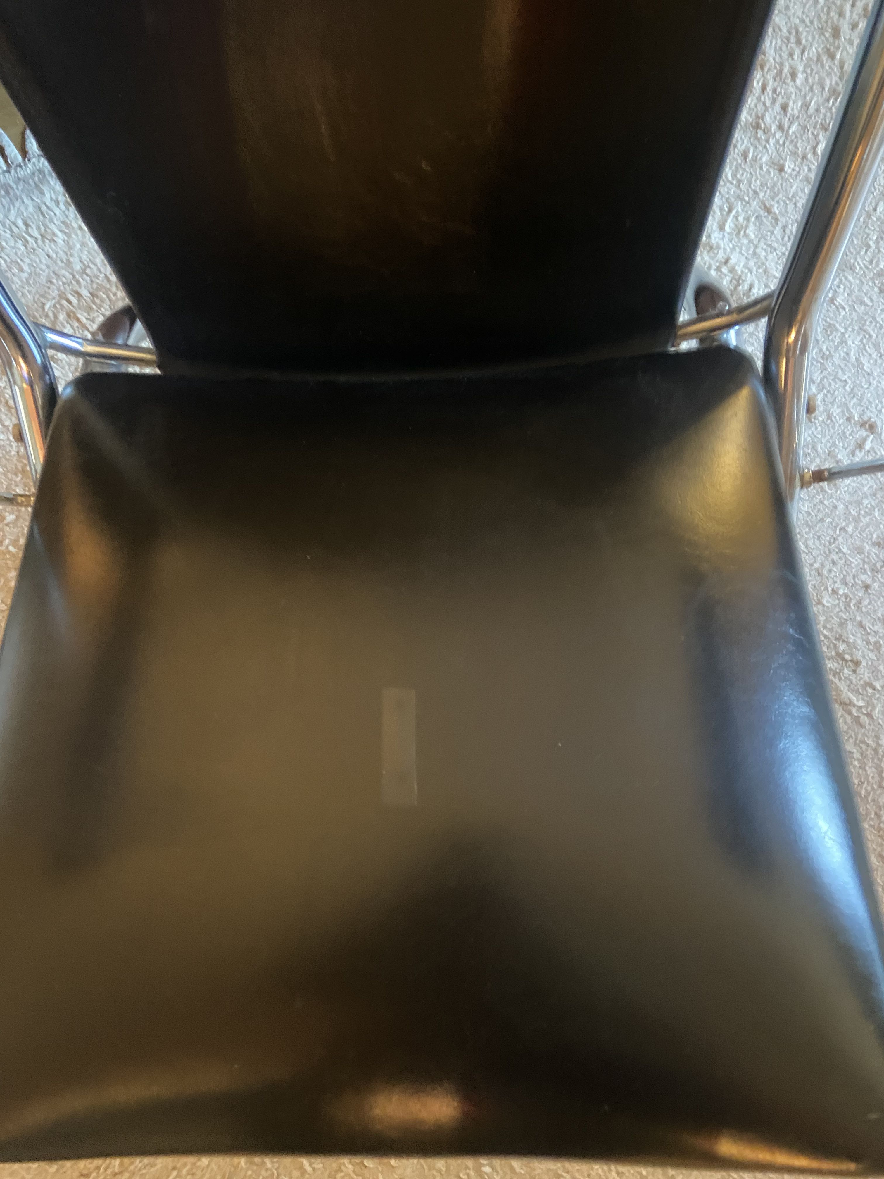 Metal armchair and black skaï