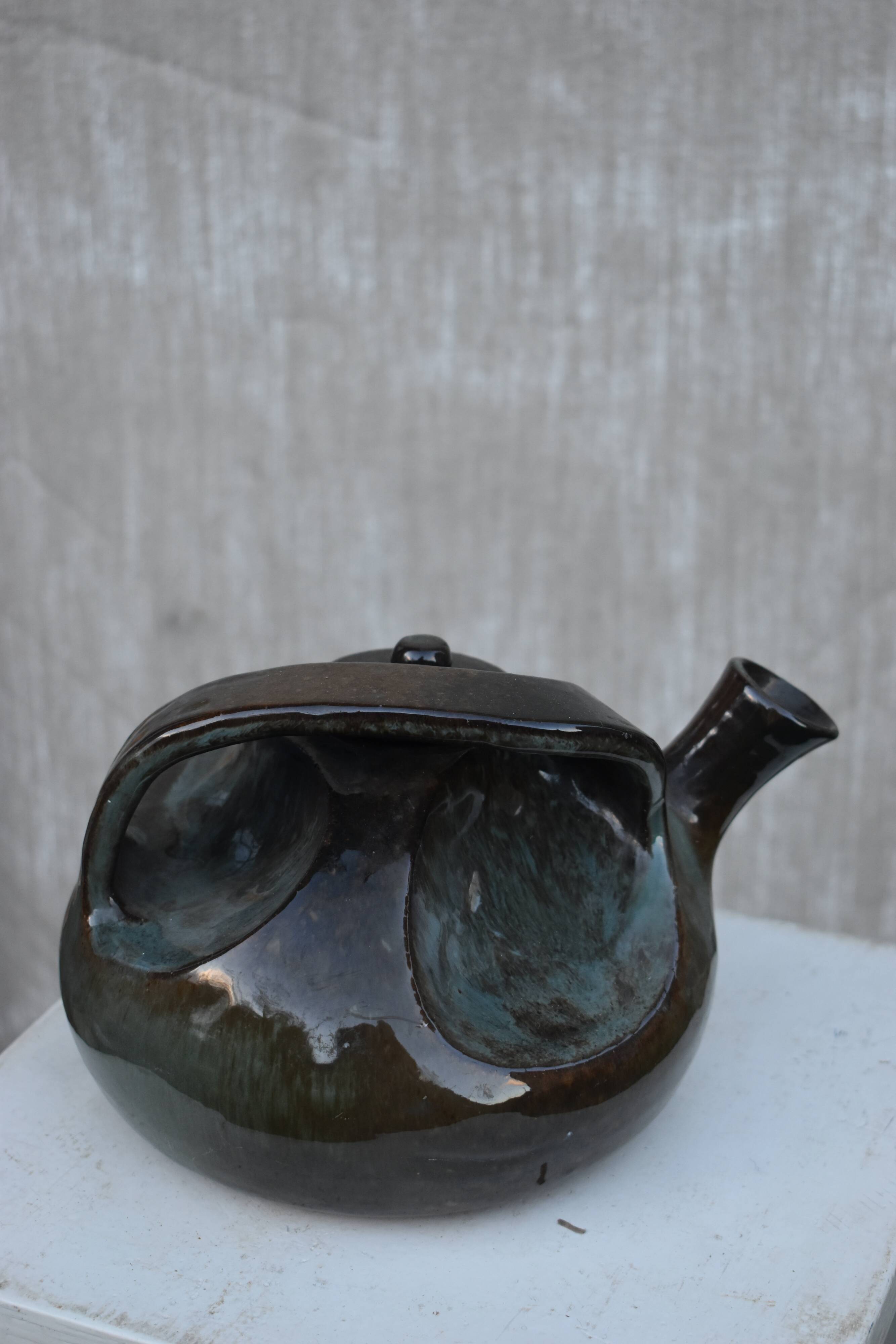 Glazed terracotta teapot