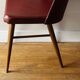 Chaise en skai rouge, pieds compas, années 60