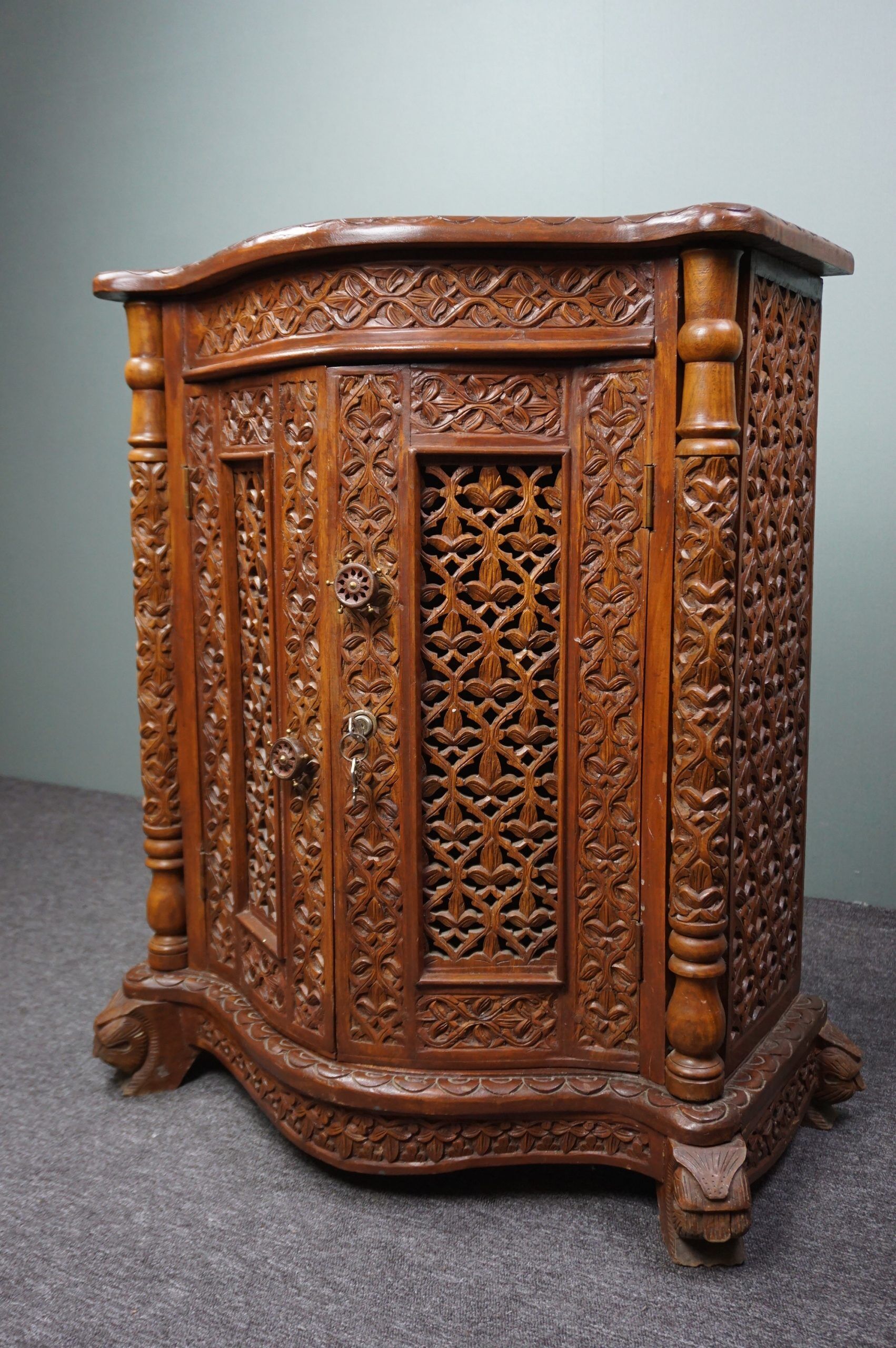 Carved wooden cabinet from the mid-20th century