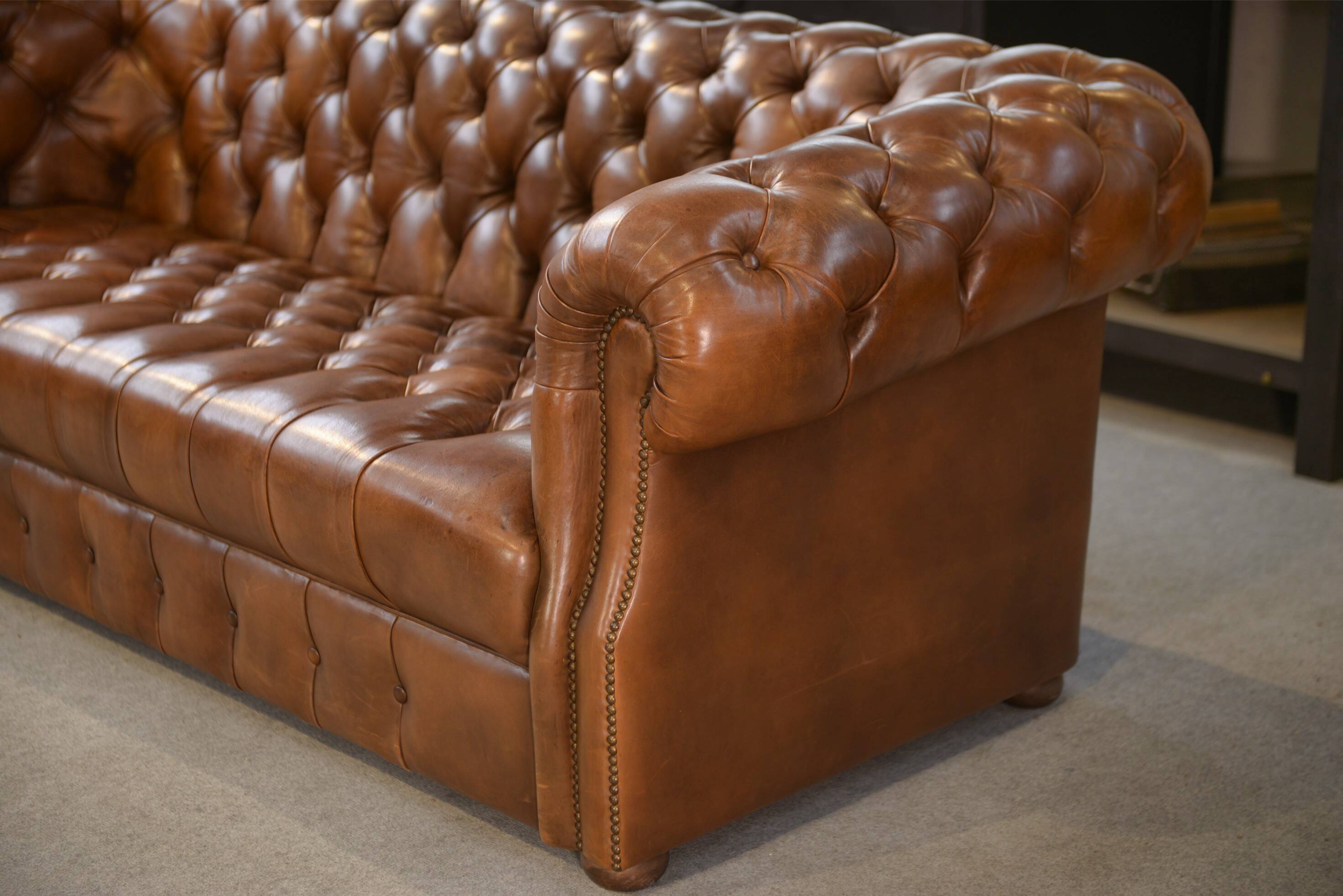 Tan leather tufted Chesterfield sofa