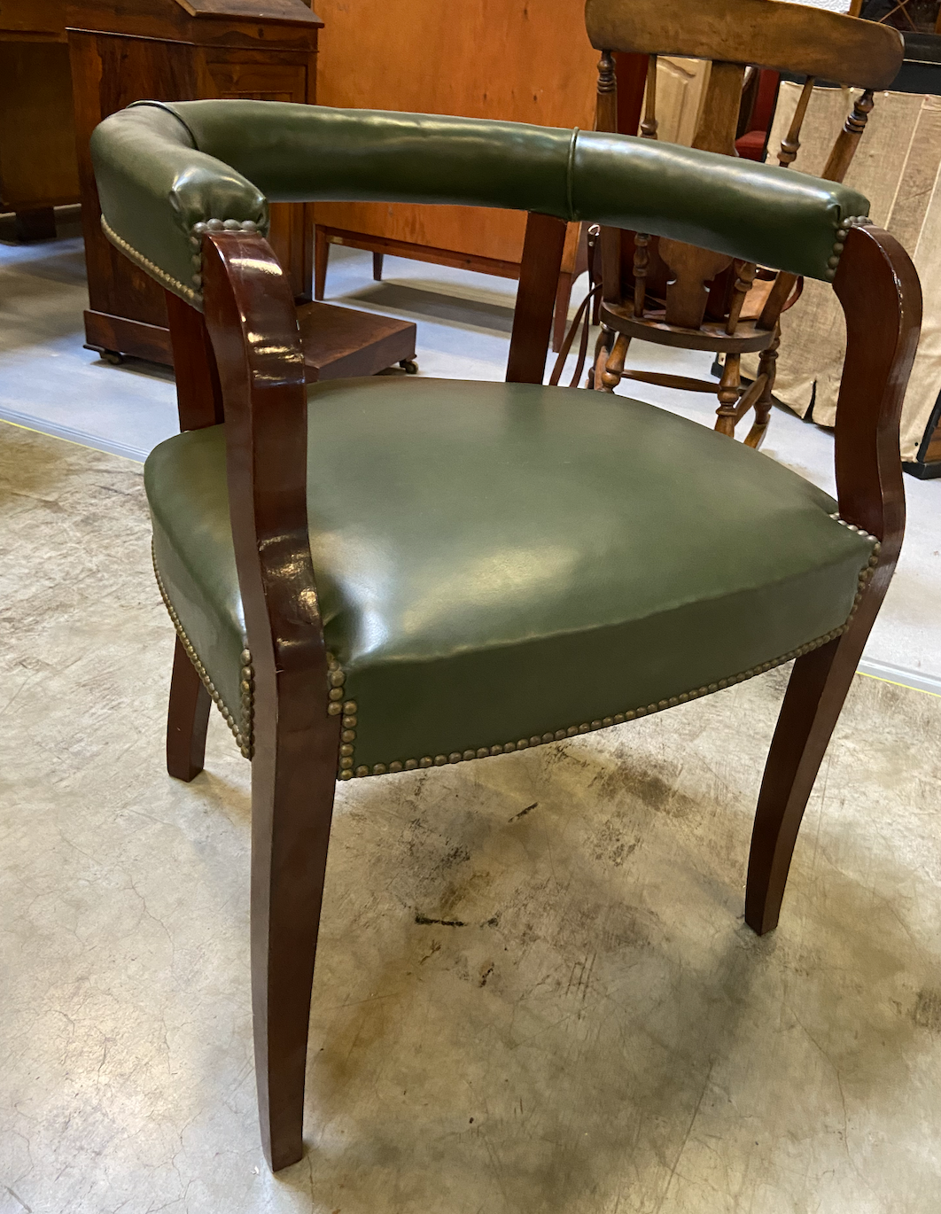 Empire style office armchair in green leather