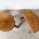 Set of three rustic solid wood tripod stools.