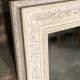 Louis XV-style mirror in wood and white stucctuc and patinated beige