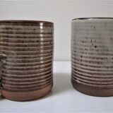 Two enamelled sandstone mugs Roger Jacques handwritten signature